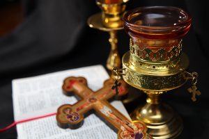 Image: Candle, cross and prayerbook